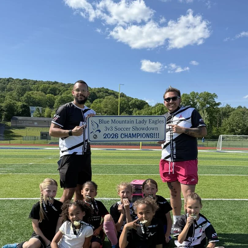 Elvis Tejada with the Hillcrest AYF Soccer 2026 Champions team